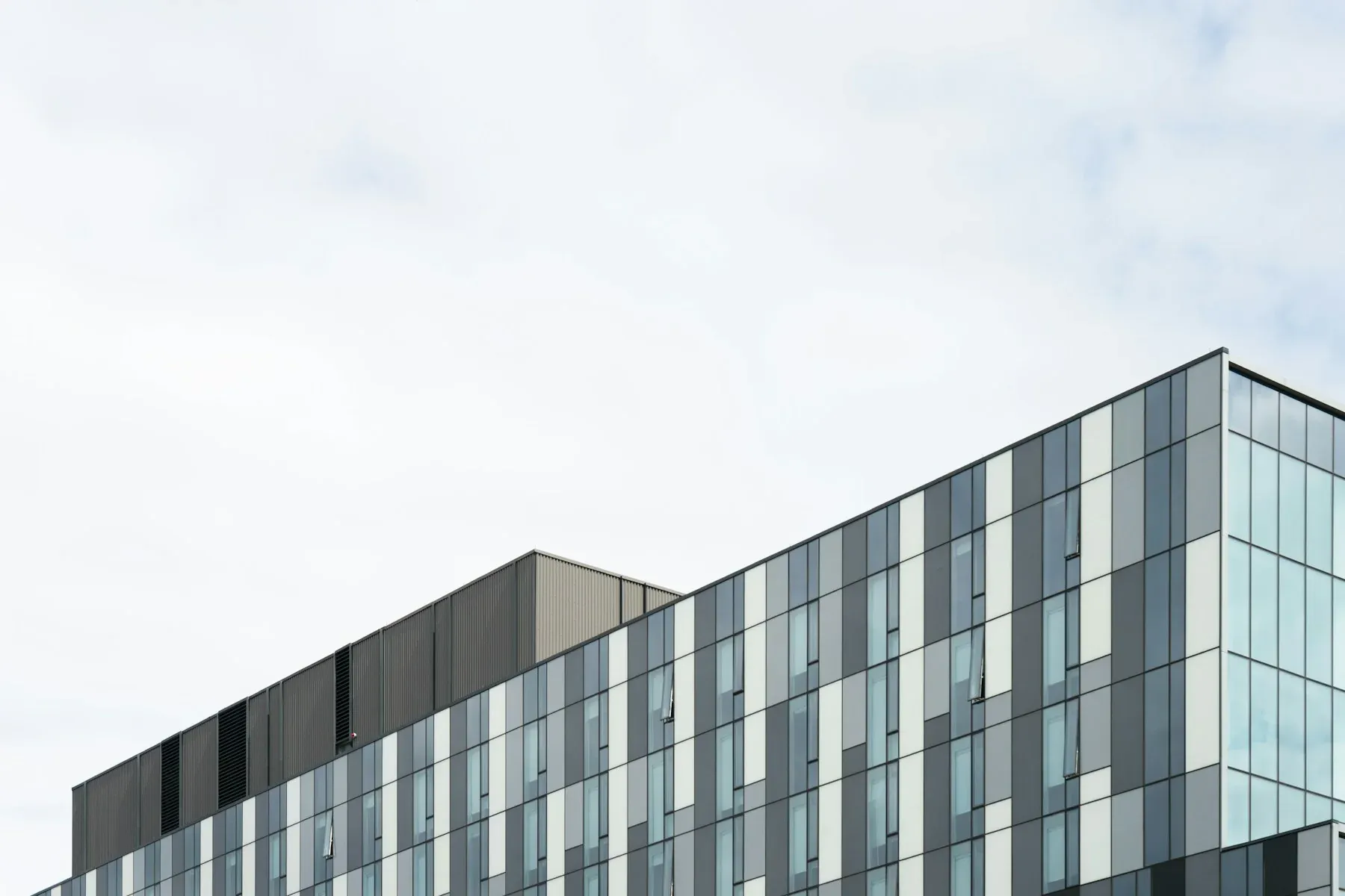A pale building façade against the sky